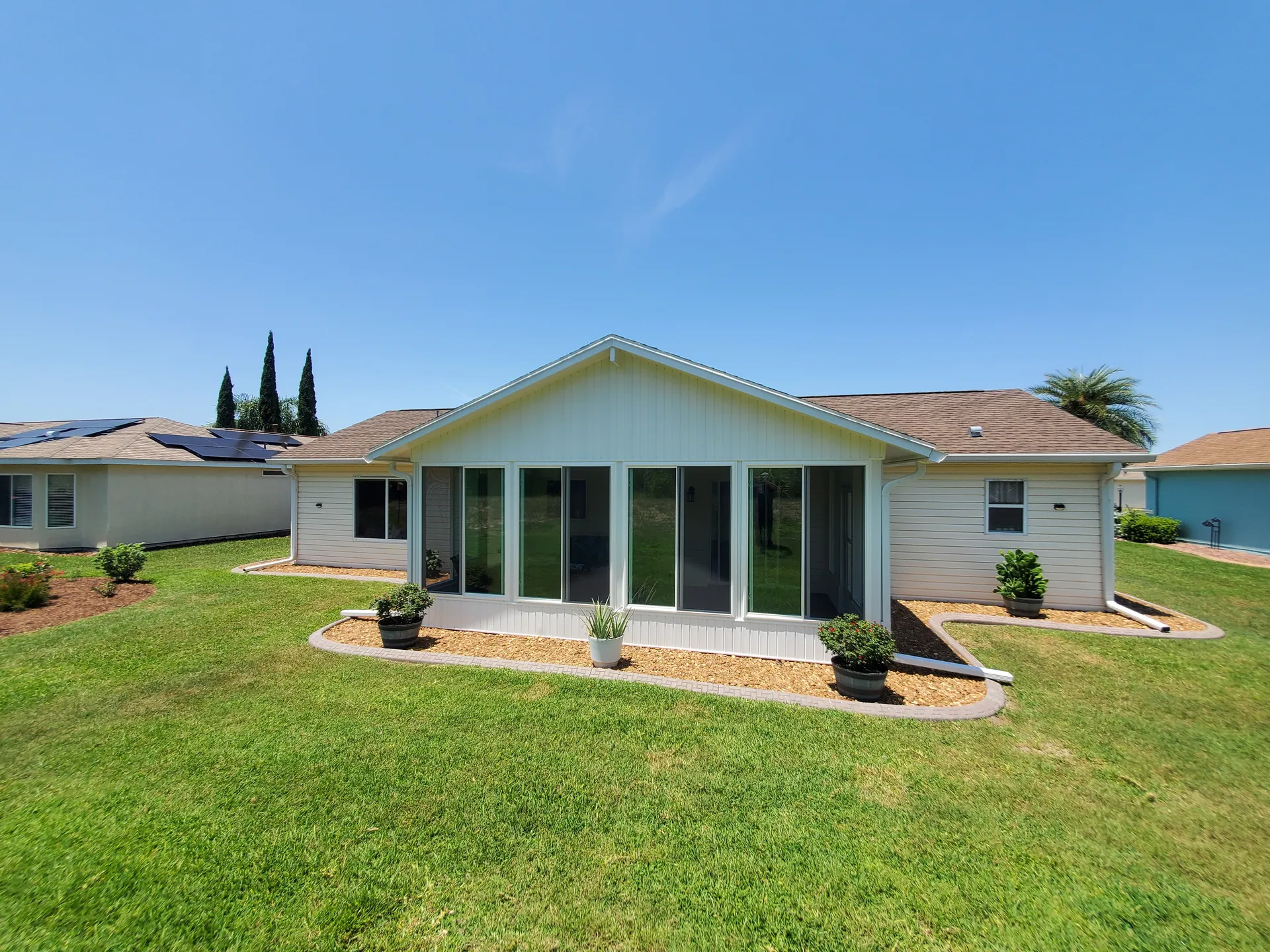 A garden-facing sunroom built by C. Musick Construction in Central Florida