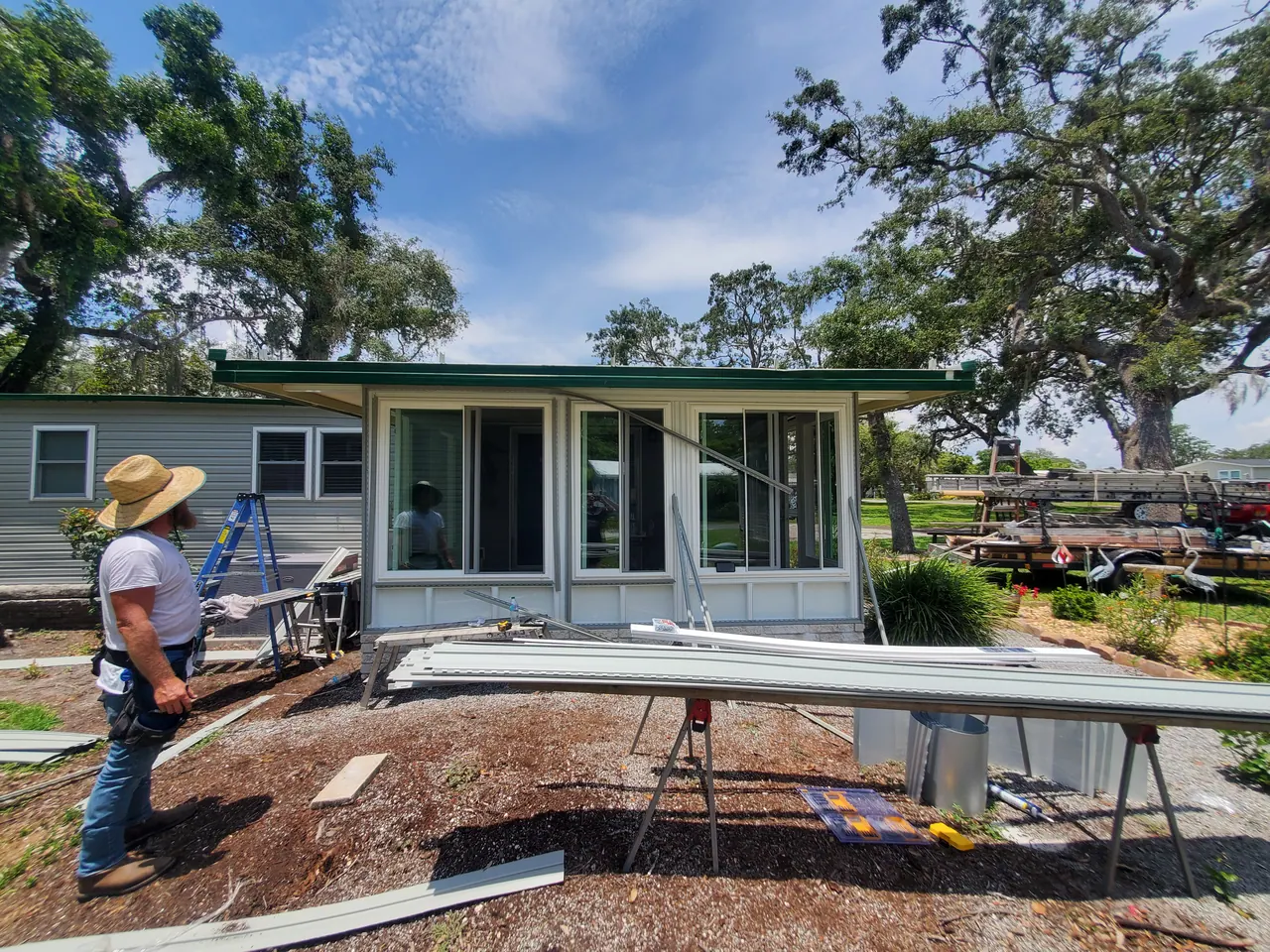 C. Musick crew working on a sunroom enclosure